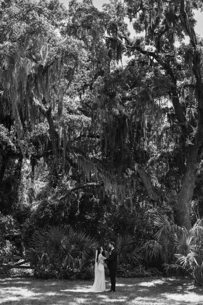 couple sharing their First Look moment along the calm South Carolina river.