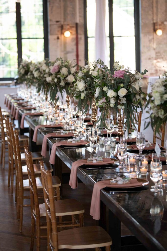Elegant gold Chiavari chairs at a Savannah wedding reception designed with coastal chic décor.
