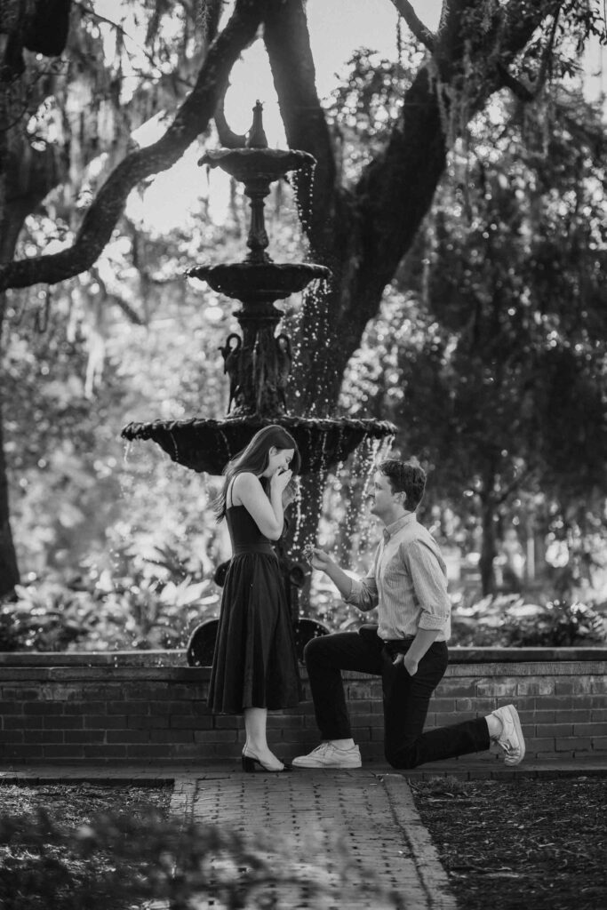He dropped to his knee in front of the Lafayette fountain to ask for her hand in marriage. Savannah, Georgia